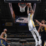 Warriors seal victory over Pacers with late run
